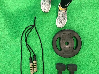 Top view of a clean training mat and athletic shoes.